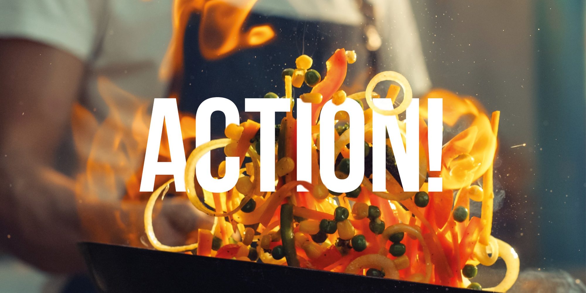 A chef tossing vegetables in a pan, with the word Action
